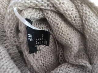 Jersey cuello alto beige largo fino