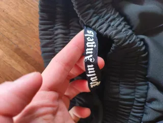 Shorts Palm Angels neri con strisce arcobaleno