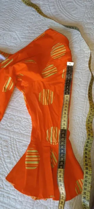 Traje de flamenca naranja y amarillo