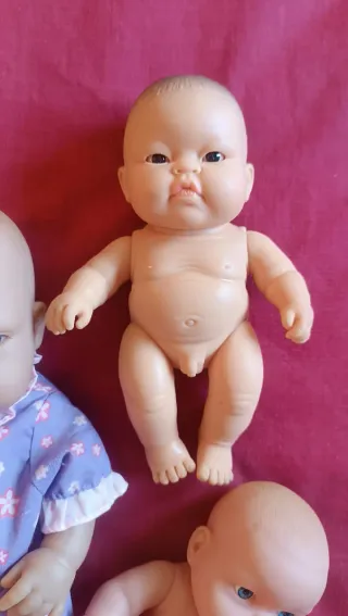Lote 4 muñecos bebé