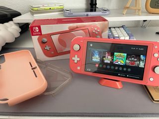 Nintendo Switch Lite Coral + Accessori