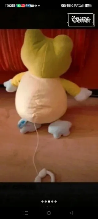 Peluche musical de rana para cuna