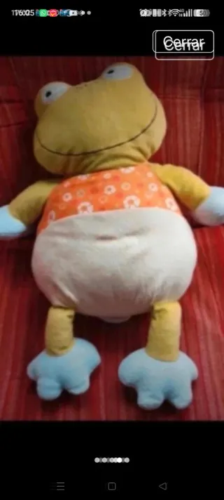 Peluche musical de rana para cuna
