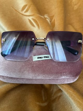 Gafas de sol Miu Miu marrones y doradas