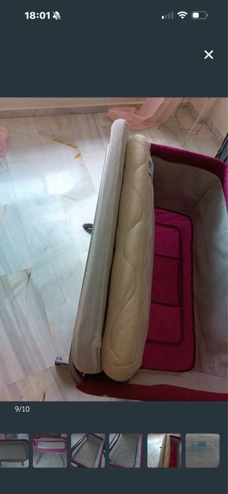 Cuna de bebé rosa en buen estado