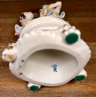 Pareja de querubines porcelana estilo Capodimonte