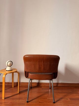 Poltrona vintage in pelle e metallo