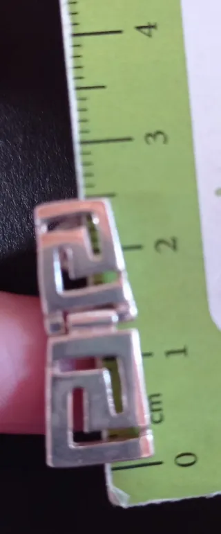 Conjunto anillo y pendientes grecas.