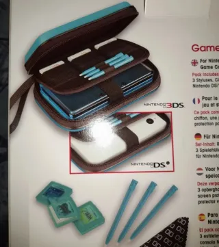 NUEVO.OFICIAL.Pack Traveller 3DS + 2 giochi NUOVI