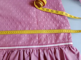 Traje de flamenca rosa con volantes