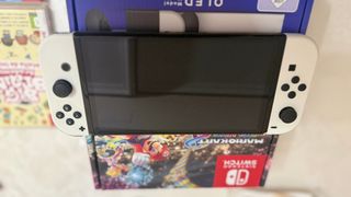 Nintendo Switch OLED + Mario Kart + Mario Wonder