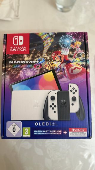 Nintendo Switch OLED + Mario Kart + Mario Wonder