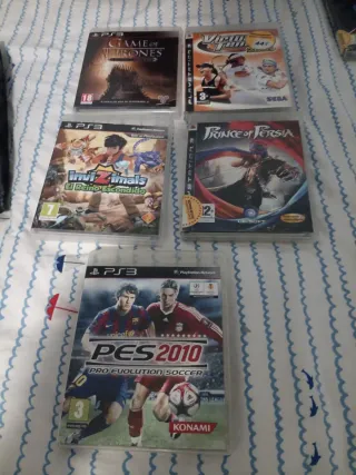 Consola PlayStation 3 con mando y 5 juegos