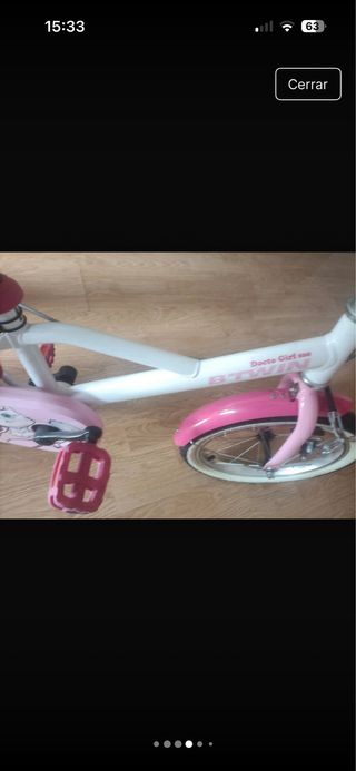 Bicicleta infantil rosa y blanca