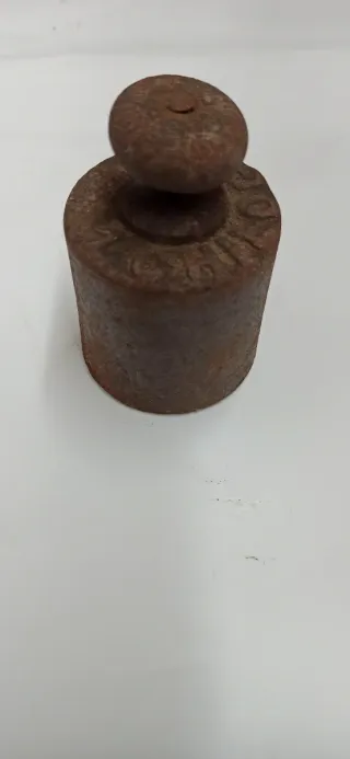 Antico gancio con peso bilancia bascula
