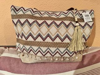 Bolso estampado flores y plumas