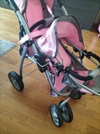 Carrito de muñecas rosa