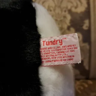 Peluche Pinguino con sciarpa rossa