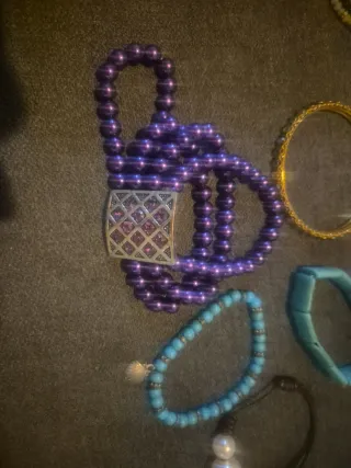 Lote pulseras moradas, turquesa y dorada