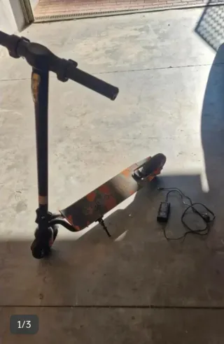 Patinete Eléctrico Naranja y Negro