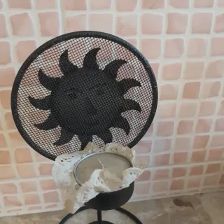 Portacandele nero a forma di sole