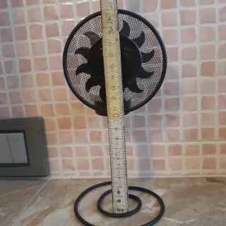 Portacandele nero a forma di sole