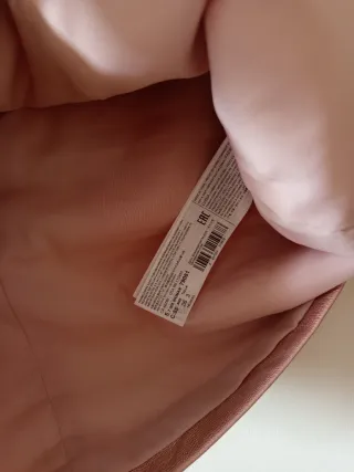 Falda corta efecto piel rosa metalizado, talla S.