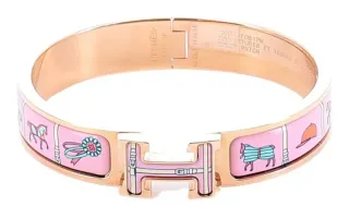 Pulsera Hermes H con caballos rosa y dorado