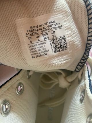 Converse All Star nere con farfalle