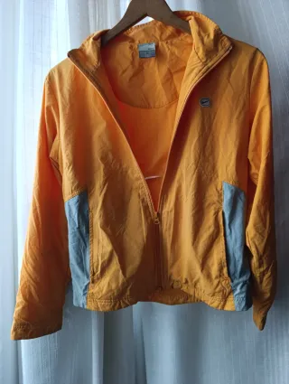 Chaqueta cortavientos Nike naranja y gris T.38/40