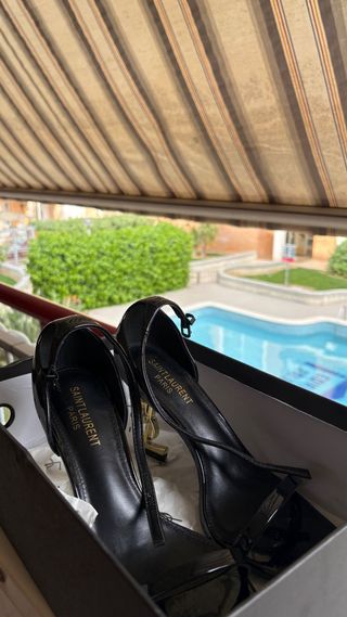 Tacchi Saint Laurent Paris Nero/Oro