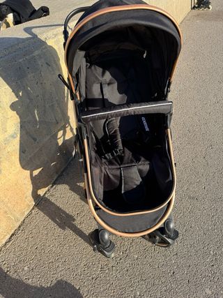 Carrito de bebé negro y dorado desde recien nacido