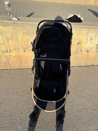 Carrito de bebé negro y dorado desde recien nacido