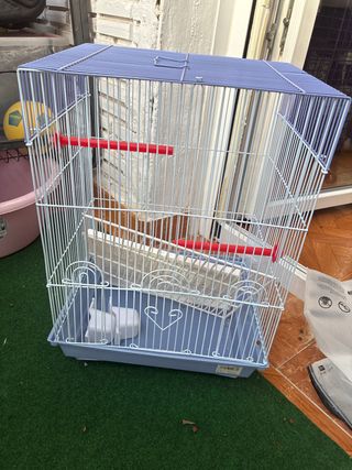 Jaula para pájaros azul y blanca