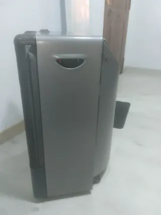 Estufa de butano con manguera naranja