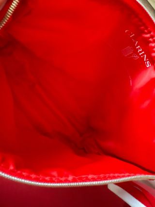 Pochette Clarins con stampa lecca-lecca