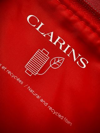 Pochette Clarins con stampa lecca-lecca