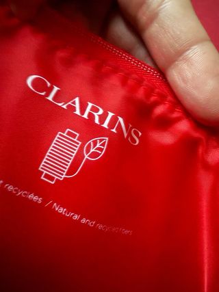 Pochette Clarins con stampa lecca-lecca
