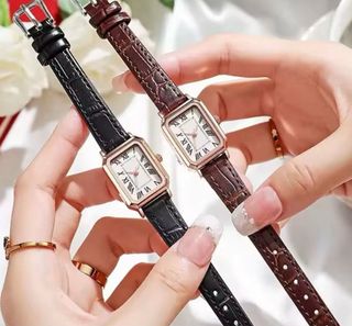 Reloj de pulsera dorado y marrón