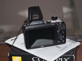 Cámara Nikon Coolpix L310 en su caja