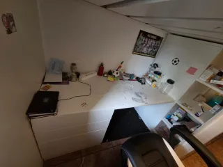 Cama alta con escritorio