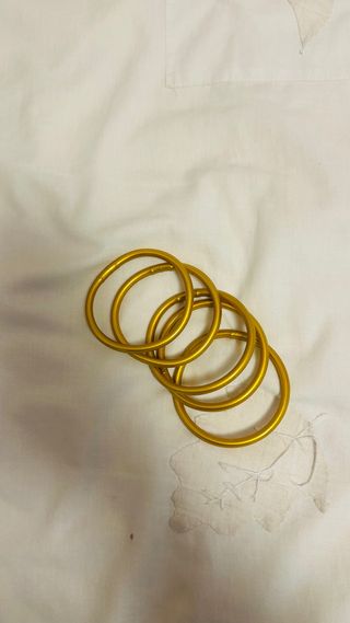 5 Pulseras Doradas