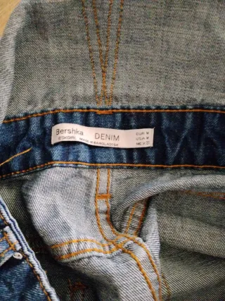 Peto corto vaquero desgastado