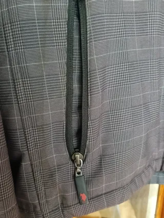 Chaqueta U.S. Polo Assn. adolescente gris.