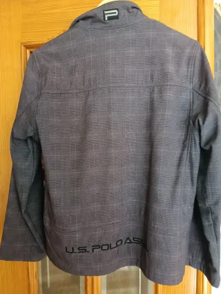 Chaqueta U.S. Polo Assn. adolescente gris.