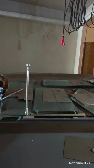 Estanterías cristal y acero cromado