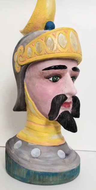 Antica scultura testa legno