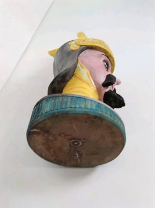 Antica scultura testa legno