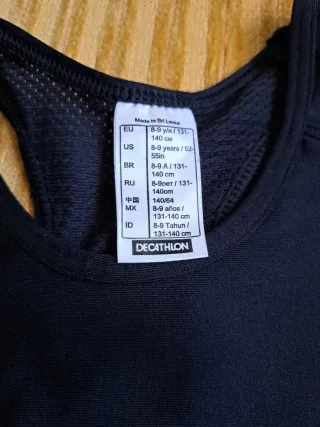 Top sportivo nero Decathlon ragazzina