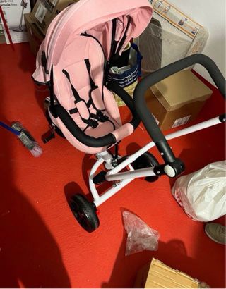 Triciclo infantil rosa con capota